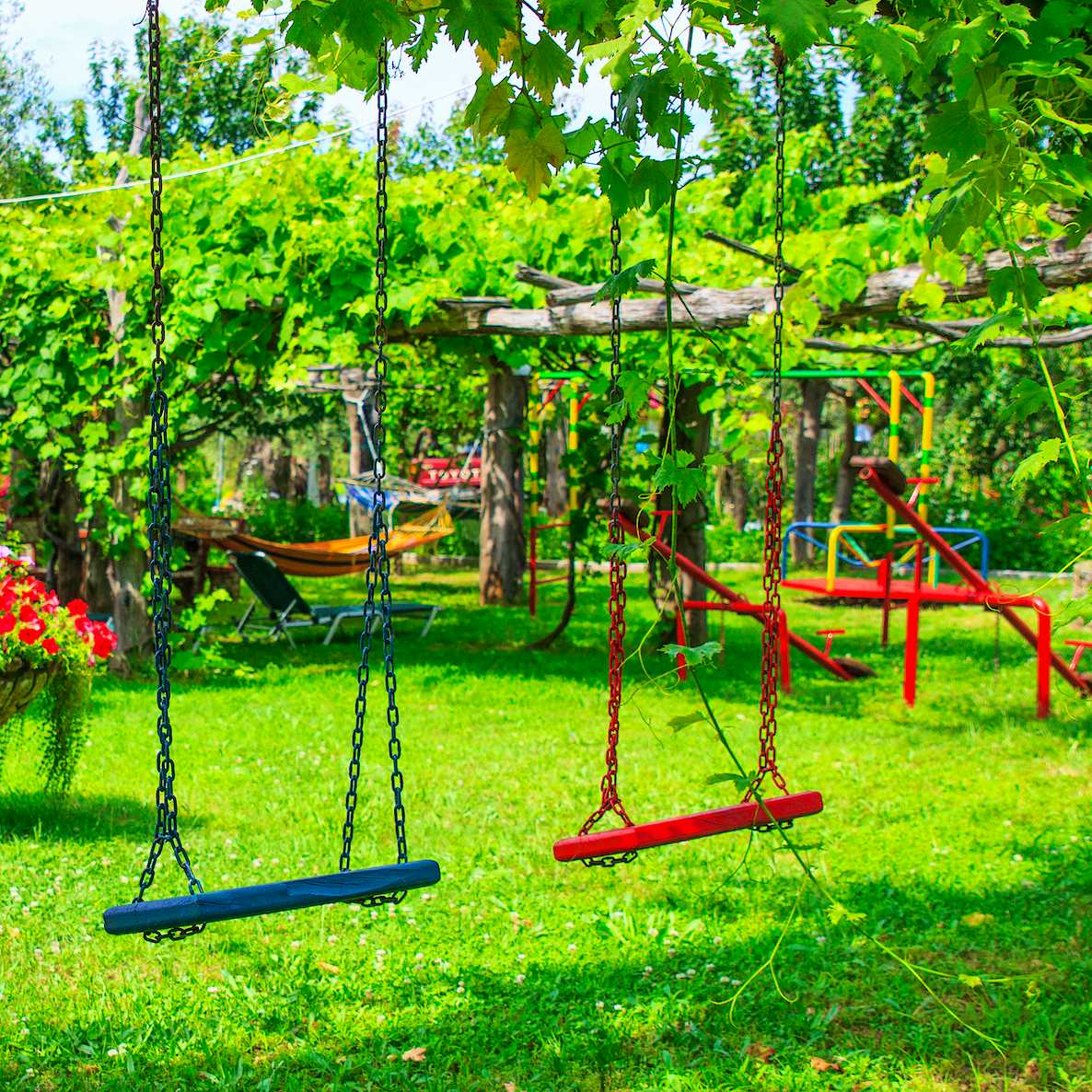 Photo Caption: Watch the children play safely in the garden's playground