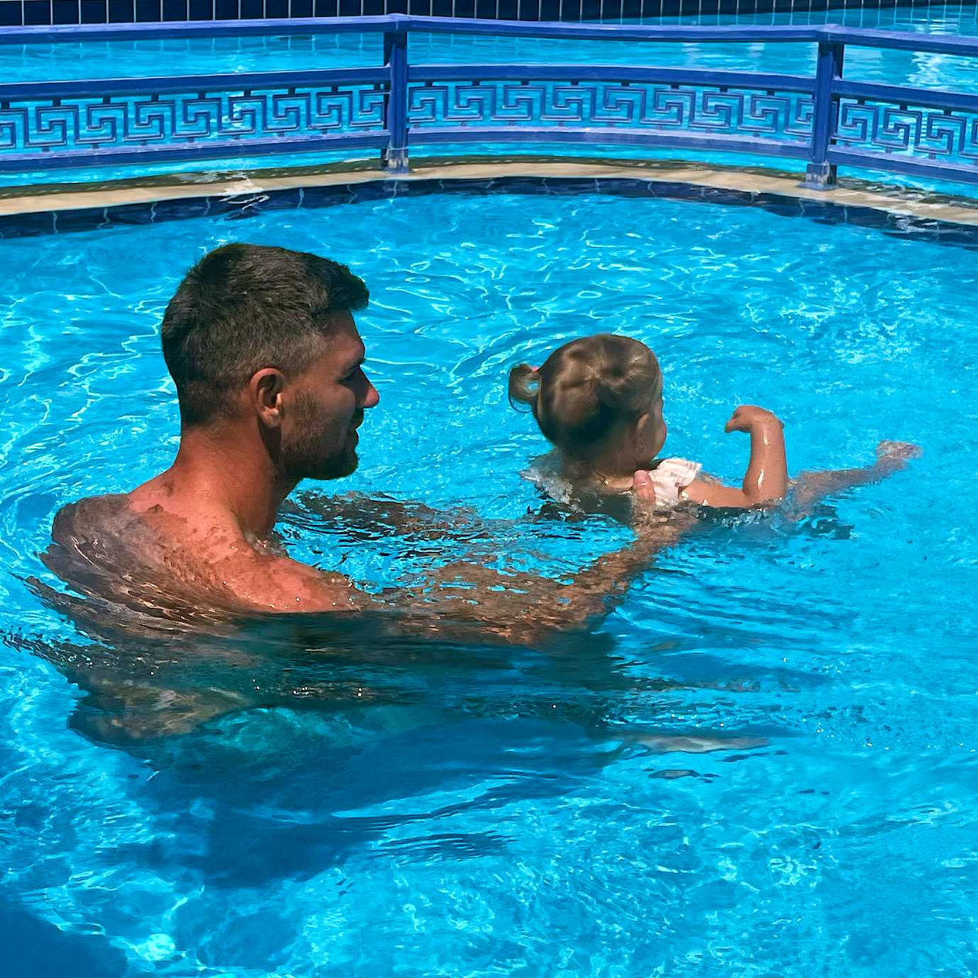 Photo Caption: Teach the little one how to swim