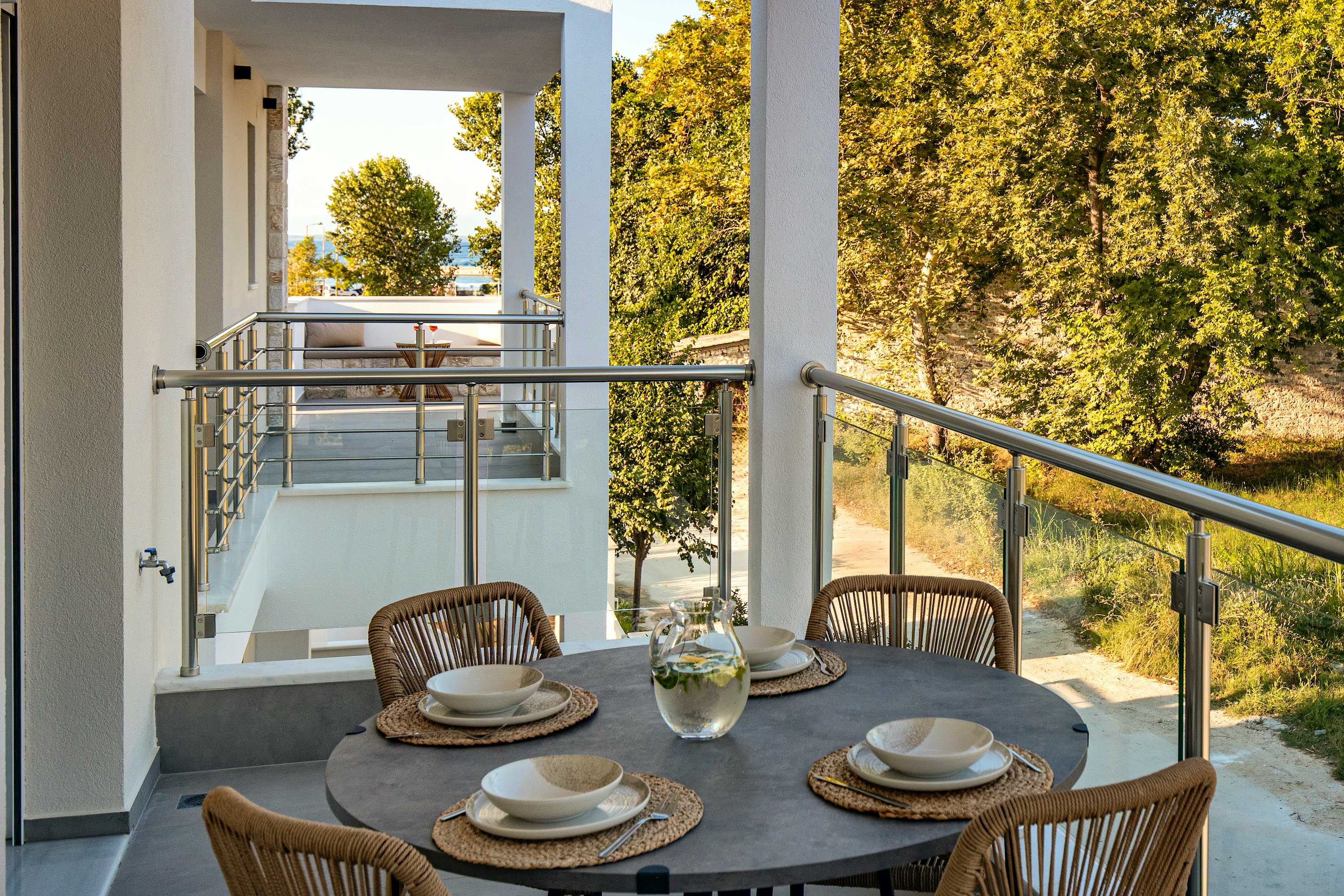 Photo Caption: Spacious Balcony Spend Time Outside Comfy seats ar